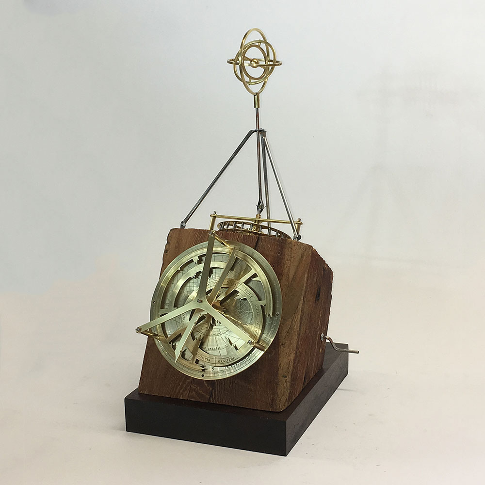 This piece features a model of an astrolabe, an ancient device used for determining time and location, enabling astronomers to calculate star locations and the passage of time.  